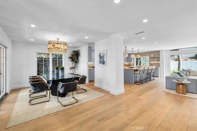 dining space with light wood-type flooring