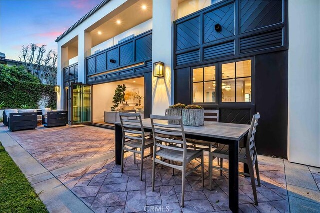 view of patio terrace at dusk