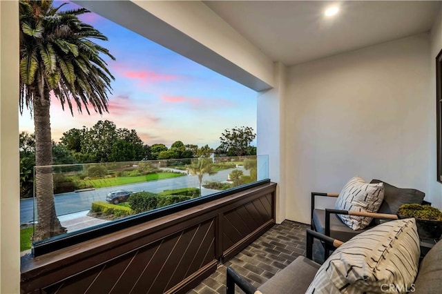 balcony at dusk with a water view