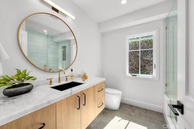 bathroom featuring an enclosed shower, vanity, and toilet