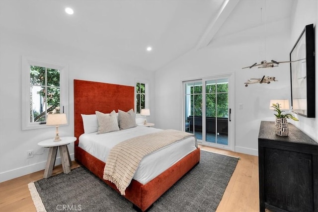 bedroom with hardwood / wood-style flooring, vaulted ceiling with beams, and access to outside