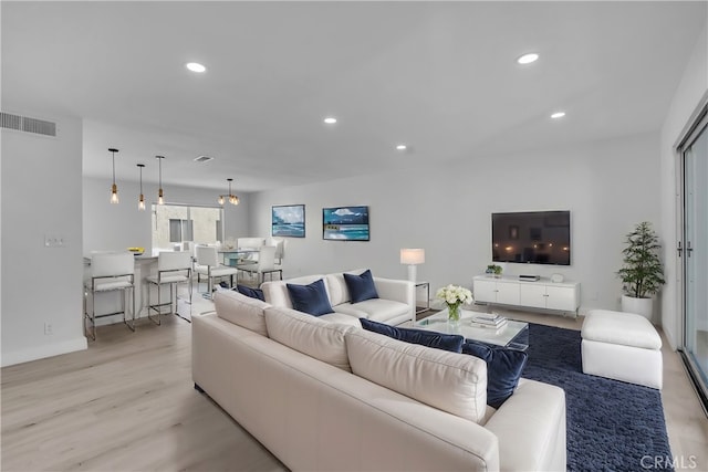 living room with light hardwood / wood-style floors