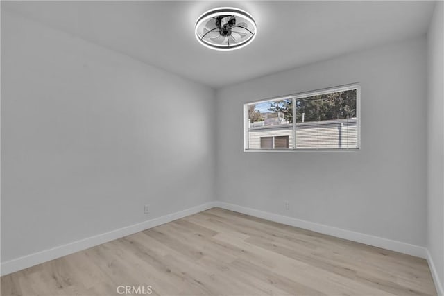 unfurnished room featuring light hardwood / wood-style floors