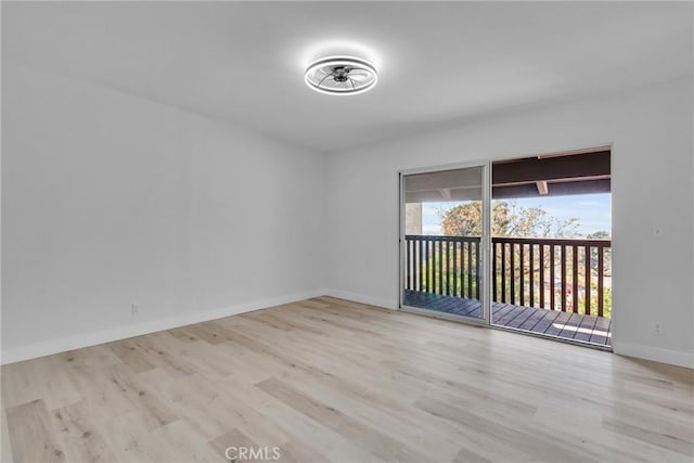 empty room with light hardwood / wood-style flooring