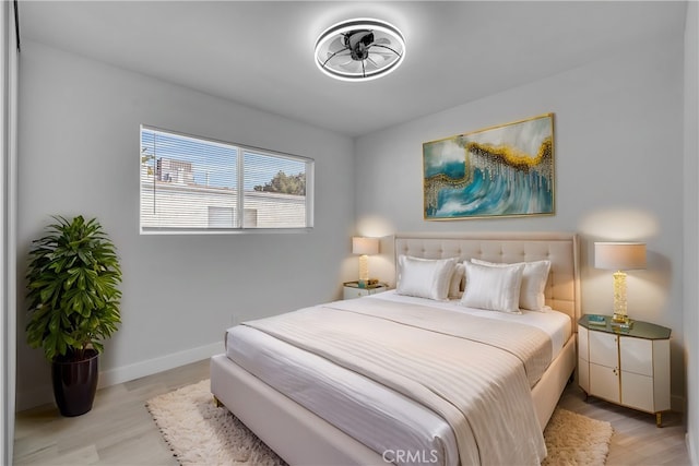 bedroom with light hardwood / wood-style floors