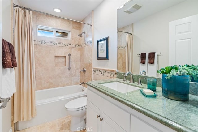 full bathroom with tile patterned flooring, vanity, tile walls, toilet, and shower / bath combo with shower curtain