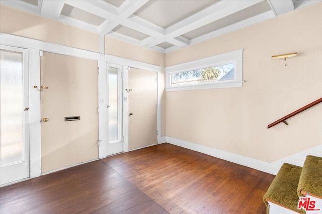 entrance foyer with dark wood-type flooring, coffered ceiling, and beamed ceiling