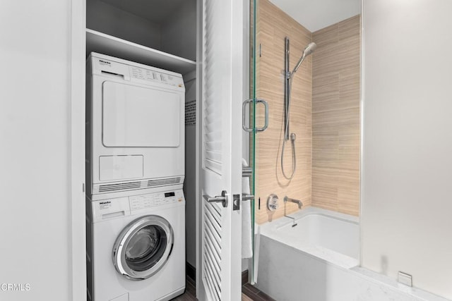 laundry room with stacked washing maching and dryer