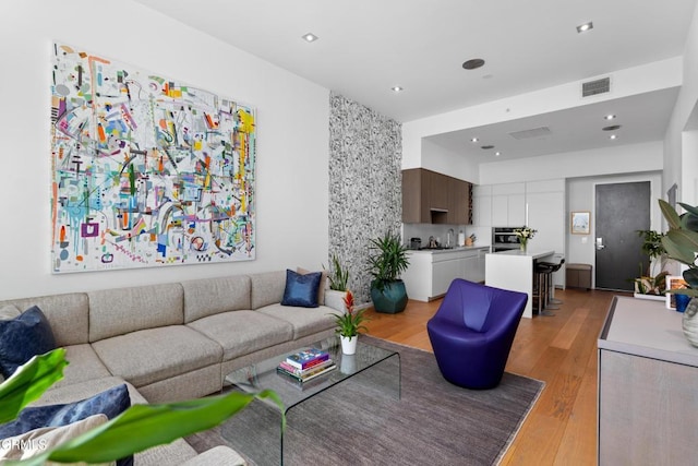 living room with light hardwood / wood-style floors