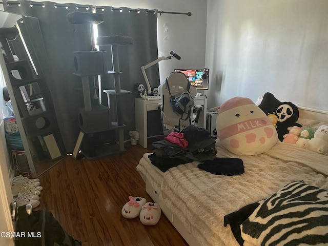 bedroom featuring dark wood-type flooring