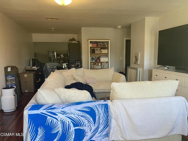 living room featuring dark wood-type flooring