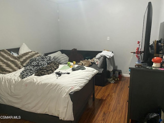 bedroom featuring hardwood / wood-style flooring