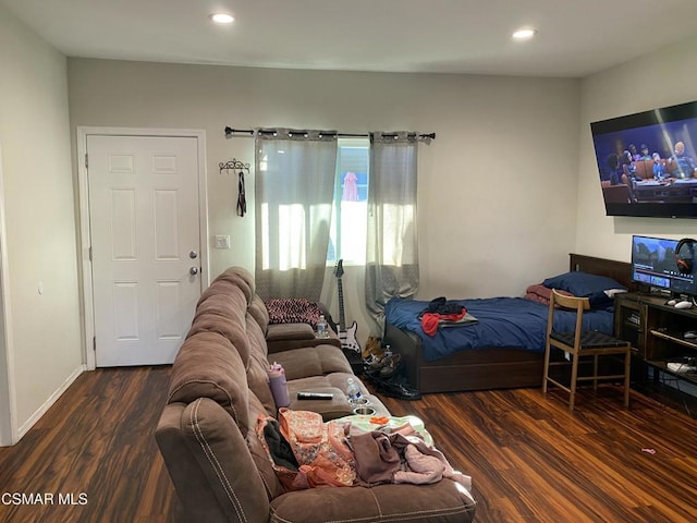 bedroom featuring dark hardwood / wood-style flooring