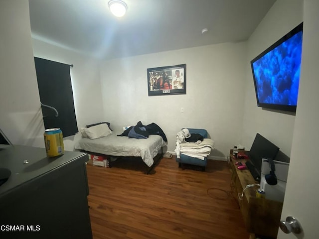 bedroom with hardwood / wood-style flooring