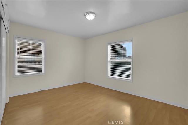 empty room with light hardwood / wood-style floors