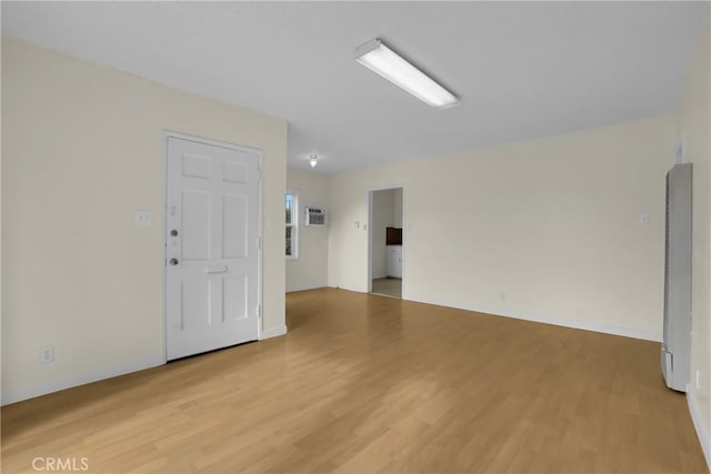 unfurnished room featuring light hardwood / wood-style flooring