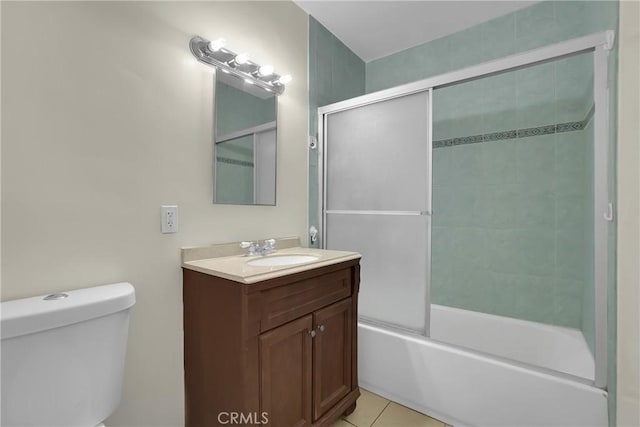 full bathroom with toilet, tile patterned flooring, vanity, and shower / bath combination with glass door