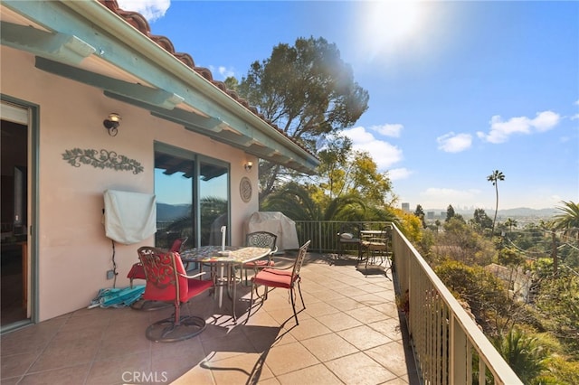 view of patio featuring a balcony