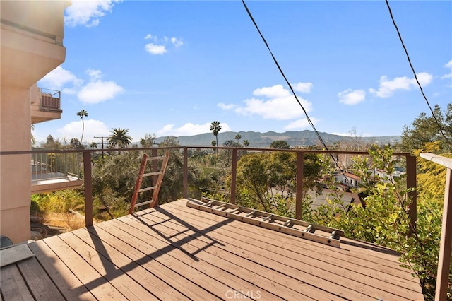 wooden terrace with a mountain view