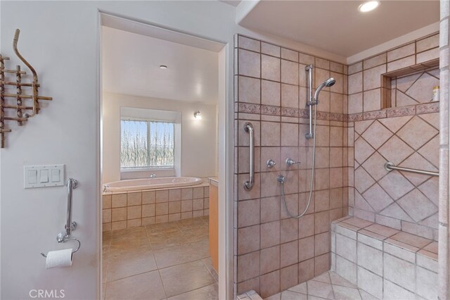 bathroom featuring independent shower and bath and tile patterned floors