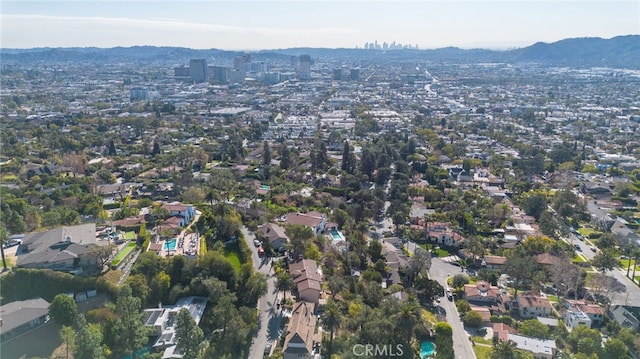 birds eye view of property with a mountain view