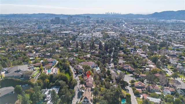 birds eye view of property with a mountain view