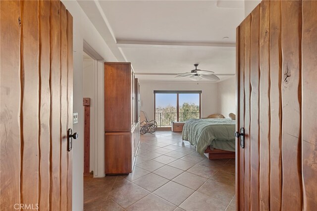 bedroom featuring ceiling fan and light tile patterned floors