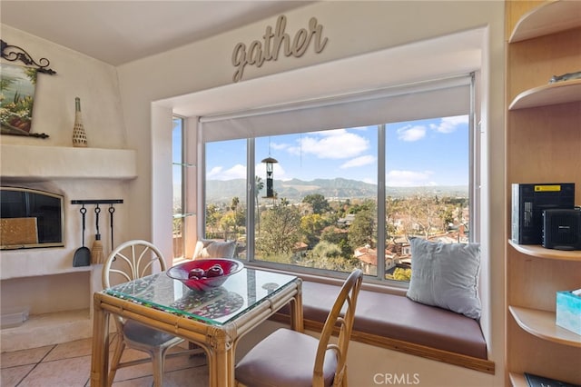 tiled dining area with a mountain view