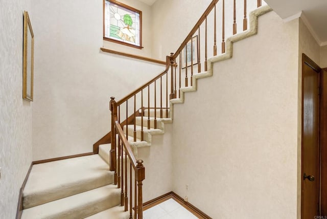 stairway with crown molding