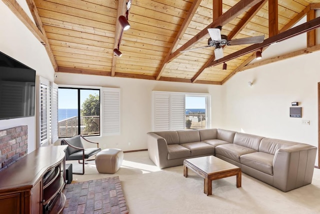 living room with wooden ceiling, light colored carpet, high vaulted ceiling, a water view, and beamed ceiling