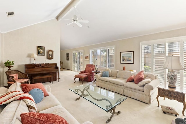 carpeted living room with ceiling fan and vaulted ceiling with beams