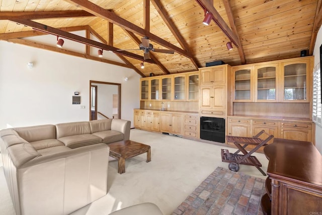 living room with wooden ceiling, rail lighting, high vaulted ceiling, and beamed ceiling