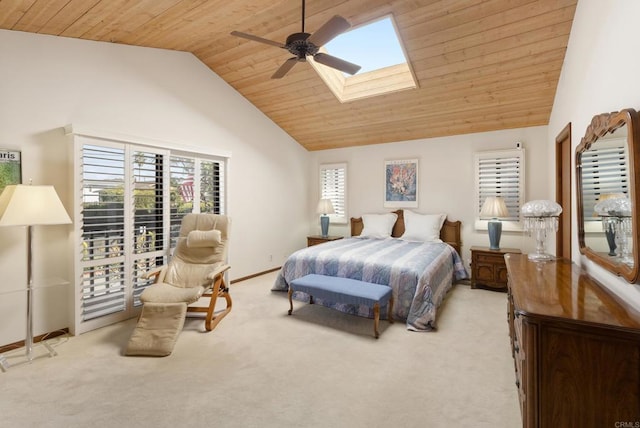 bedroom with ceiling fan, light colored carpet, lofted ceiling with skylight, and wooden ceiling