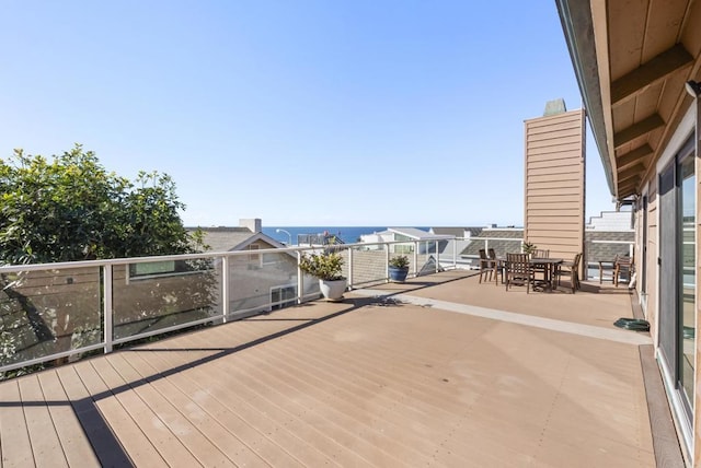 wooden deck with a water view