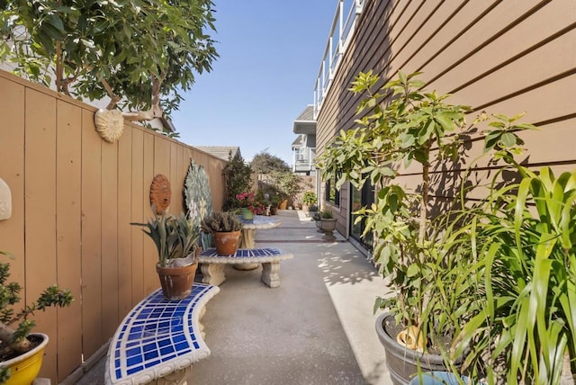 view of home's community with a patio area