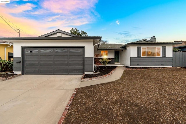 single story home featuring a garage