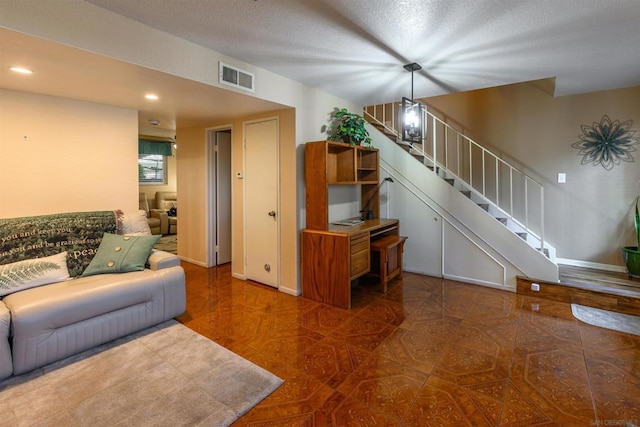 living room with a textured ceiling