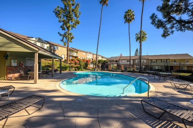 view of swimming pool with a patio area