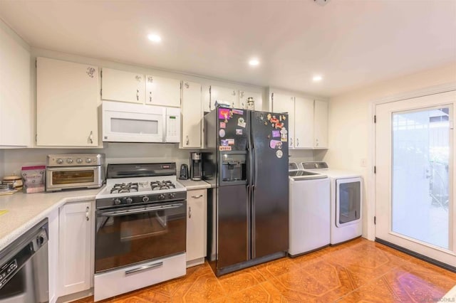 kitchen with separate washer and dryer, white appliances, and white cabinets