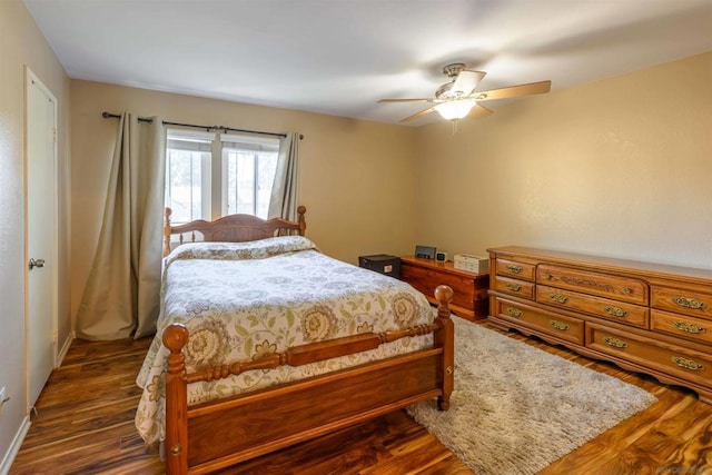 bedroom featuring ceiling fan and dark hardwood / wood-style floors