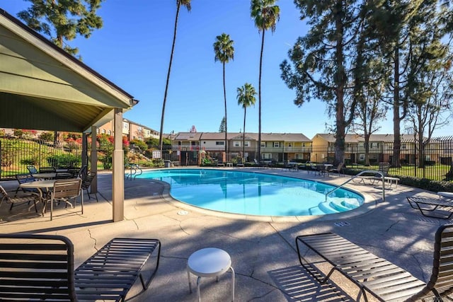 view of swimming pool with a patio area