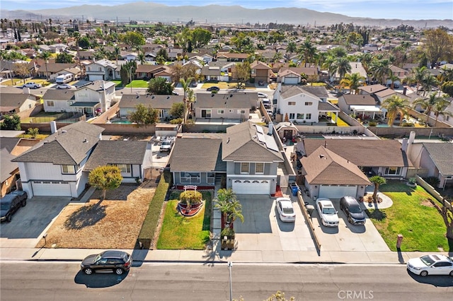 birds eye view of property with a mountain view