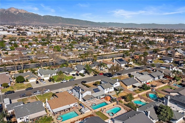 birds eye view of property featuring a mountain view