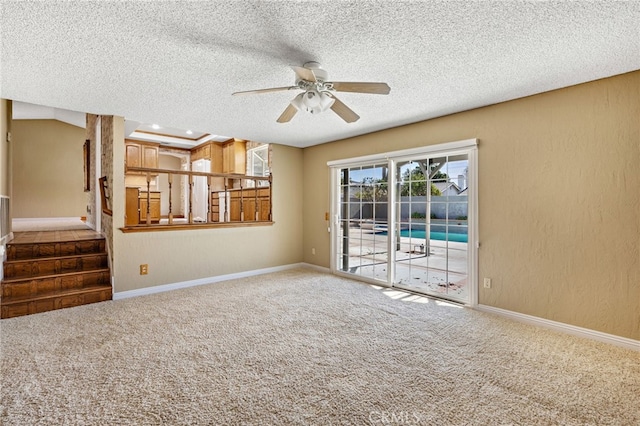 interior space featuring ceiling fan and a textured ceiling