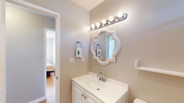 bathroom with hardwood / wood-style flooring and vanity