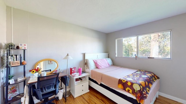 bedroom featuring wood-type flooring