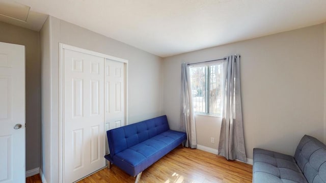 sitting room with hardwood / wood-style flooring