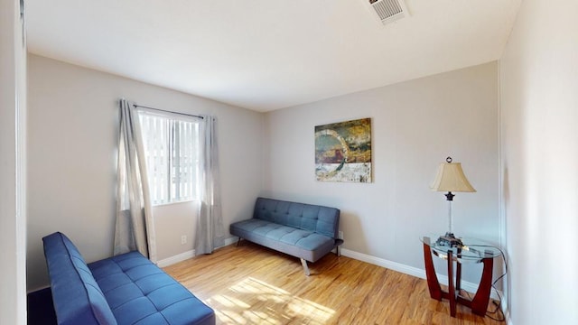 sitting room featuring light hardwood / wood-style flooring