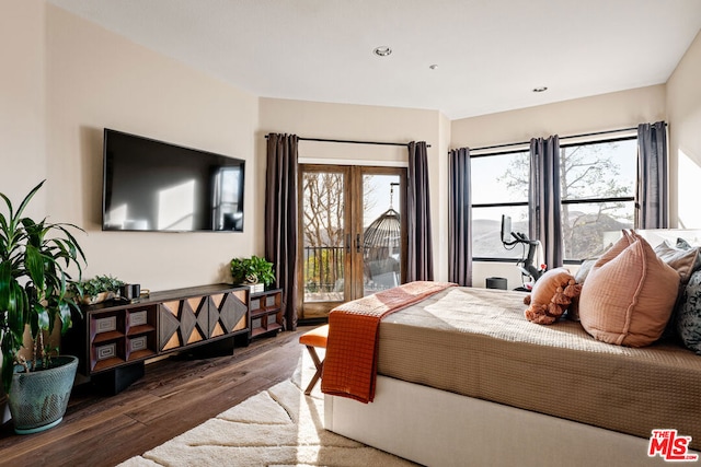 bedroom featuring dark wood-type flooring and access to outside