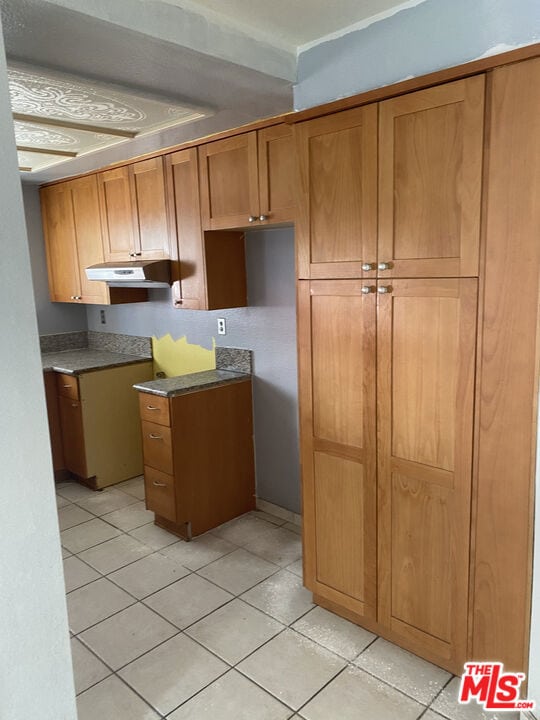 kitchen with light tile patterned floors